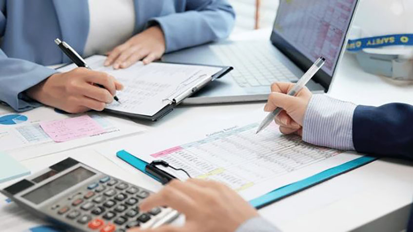 Accountants reviewing tax risks in financial records